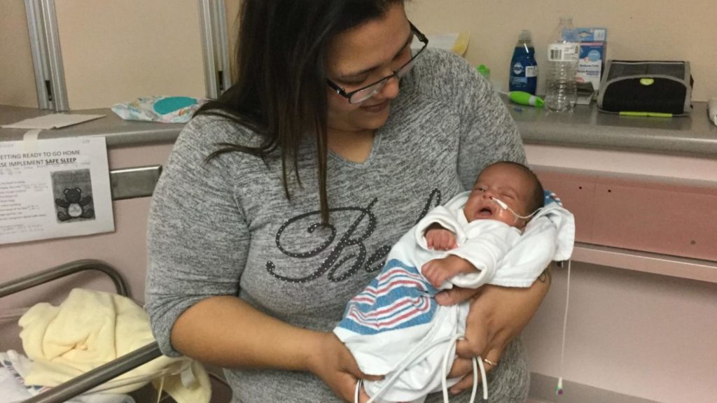 Connie De La Rosa holds baby Angel in the NICU at University Hospital. She's the first participant in a new study of Family Nurture Intervention.
WENDY RIGBY / TEXAS PUBLIC RADIO